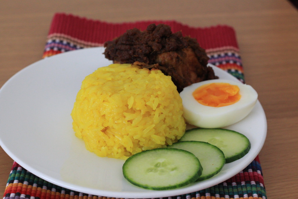 Yellow sticky rice and rendang