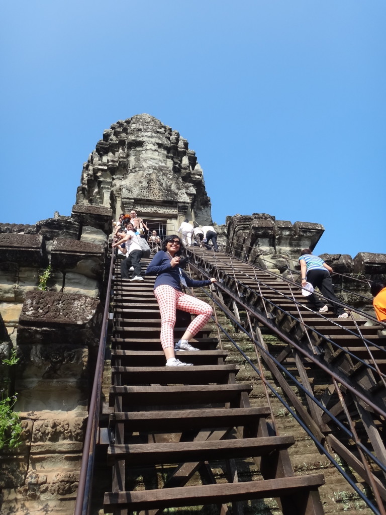 Climbing the central tower, Angkor Wat